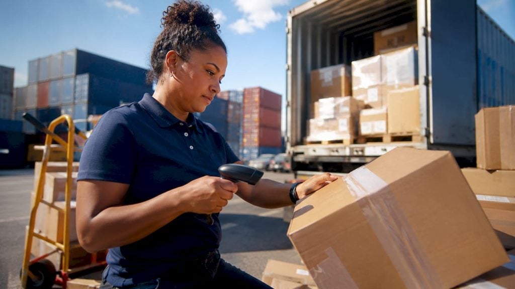 Warehouse worker scanning packages for FBA prep