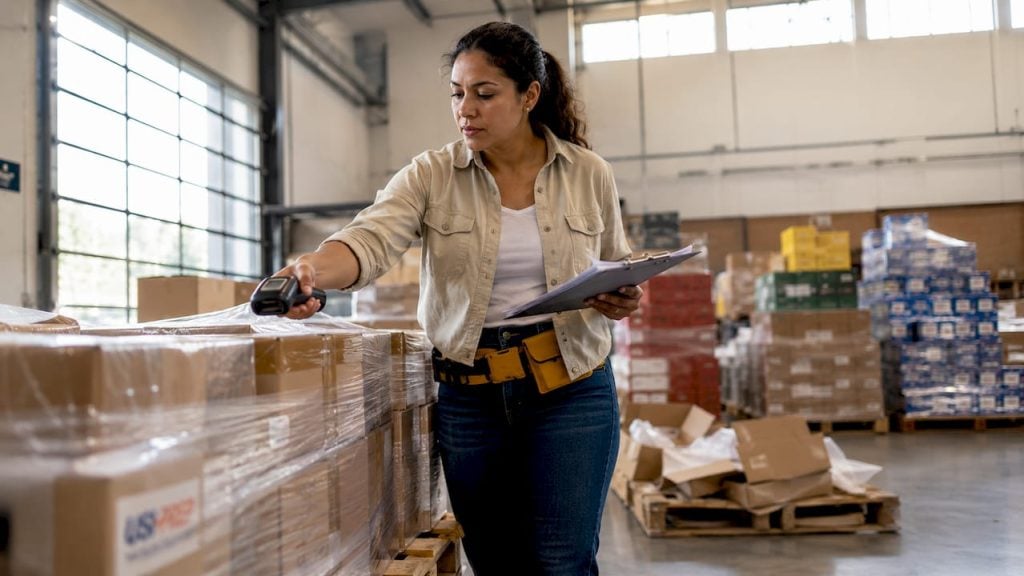 Woman scanning inventory in Walmart fulfillment warehouse