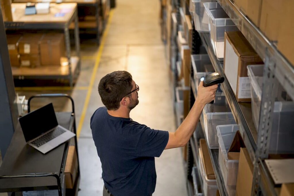 Warehouse worker scanning packages